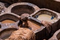 Chouara Tannery in Morocco, with round stone vessels for dyeing and softening leather in Fez el Bali Royalty Free Stock Photo