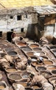 Men working at the famous Chouara Tannery in the Fez medina in Morocco. Royalty Free Stock Photo