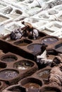 Men working at the famous Chouara Tannery in the Fez medina in Morocco. Royalty Free Stock Photo