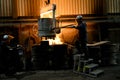 Men working with glowing molten hot steel. Steel casting. Royalty Free Stock Photo