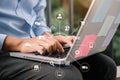 Men working on laptop keyboard at outdoor