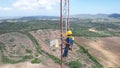 men working in meteorological tower next to stotm Royalty Free Stock Photo