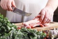 Men working with raw meats in kitchen Royalty Free Stock Photo