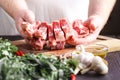 Men working with raw meats in kitchen Royalty Free Stock Photo