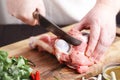 Men working with raw meats in kitchen Royalty Free Stock Photo