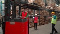 Men working in warehouse with flok lift