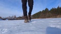 Men& x27;s shoes close up, steps on the snow time lapse shooting on a winter sunny day outdoors. Royalty Free Stock Photo