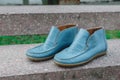 men's shoes moccasins blue color. photo on the street