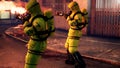 Men in yellow protective suits disinfect the city`s infected territory with a flamethrower. People in bacteriological
