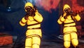 Men in yellow protective suits disinfect the city`s infected territory with a flamethrower. People in bacteriological
