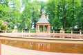 Menagerie with a pond, with a beautiful fence and a gazebo in the center of the pond.