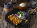 Menchi katsudon with white rice and salad served in a dish isolated on wooden background side view of japanese food Royalty Free Stock Photo
