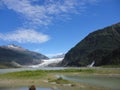 Mendenhall Glacier Juneau Alaska. Mendenhall Glacier flowing into Mendenhall Lake in between mountains with Nugget falls. Perfect Royalty Free Stock Photo