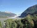 Mendenhall Glacier Juneau Alaska. Mendenhall Glacier flowing into Mendenhall Lake in between mountains with Nugget falls. Perfect Royalty Free Stock Photo