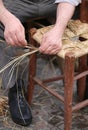 mender of chairs while repairing old wooden chair