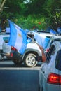 2020-10-12, Mendoza, Argentina: A man holds an argentinian flag from his car during a protest against the national government