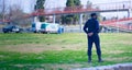 2020-09-06, Mendoza, Argentina - Police officer keeps a perimeter while medical services await for a helicopter