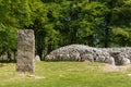 Menhir and the circular grave site at Clava Cairns.