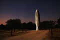 Menhir lit at night