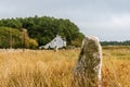 Menhir and typical House in the Carnac Alignments, Brittany Region. France