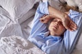 Menopausal Mature Woman Suffering With Insomnia In Bed At Home 