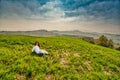 Menopausal woman on green hill