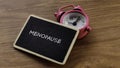 Menopause Concept with Pink Alarm Clock and Blackboard Royalty Free Stock Photo