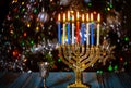 Menorah with burning candles for Hanukkah on sparkle background with defocused lights. Jewish holiday Royalty Free Stock Photo