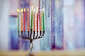 Menorah with candles for Hanukkah against defocused lights, Royalty Free Stock Photo