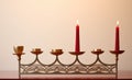 A menorah with five lit candles on a table. AI. Royalty Free Stock Photo