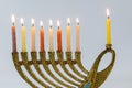 Menorah with lit candles in celebration of Chanukah. A symbolic candle lighting for the Jewish holiday Royalty Free Stock Photo