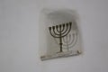 Menorah and it`s shadow in a niche in a white wall Royalty Free Stock Photo