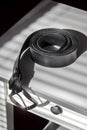 Mens belt on a bedstand Royalty Free Stock Photo
