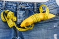 Mens denim pants with banana imitating male genitals, close up Royalty Free Stock Photo