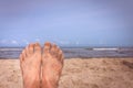Mens feet on the beach Royalty Free Stock Photo