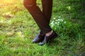 Mens feet in brown shoes close up