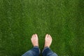 Mens feet standing on grass