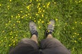 Mens feet standing on grass