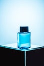 mens fragrance in blue spray bottle, Royalty Free Stock Photo