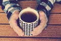 Mens hands hold a cup of hot tea. A man is drinking tea. Royalty Free Stock Photo