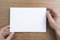 Mens hands holding empty white letterhead Royalty Free Stock Photo