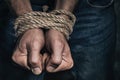 Mens hands tied with a rope. Concept of imprisonment in modern society Royalty Free Stock Photo