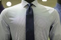 Mens mannequin wearing a business shirt and neck tie