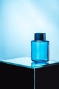 mens perfume in blue spray bottle, Royalty Free Stock Photo