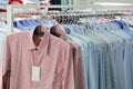 Mens plaid shirts on hangers in a retail store Royalty Free Stock Photo