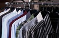 Mens shirts in different colors on hangers Royalty Free Stock Photo