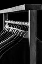 Mens shirts, suit hanging on rack. Hangers with jackets on them in boutique. Suits for men hanging on the rack. Mens Royalty Free Stock Photo