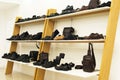 mens shoes and accessoires on wooden shelves