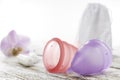 Menstrual cup on an old wooden table