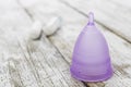 Menstrual cup on an old wooden table